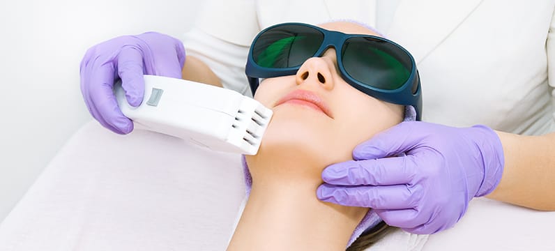 Woman receiving facial Laser Skin Rejuvenation & IPL Treatment in Miami