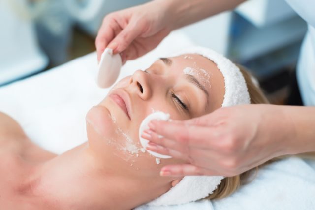 woman getting facial exfoliation