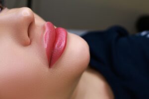 Closeup of woman's beautiful lips after lip filler treatment